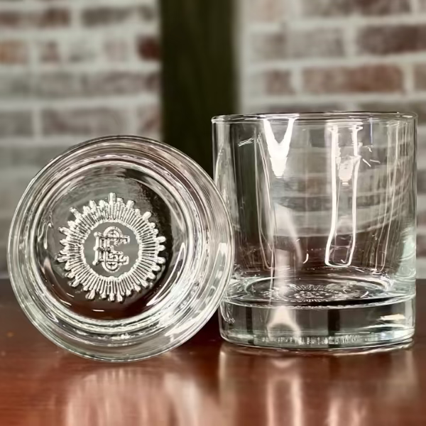 El Guapo premium branded rocks glass with custom crest bottom.