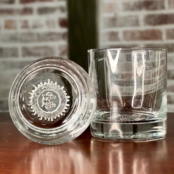 El Guapo premium branded rocks glass with custom crest bottom.
