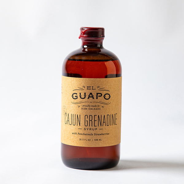 Bottle of 16.5 oz Cajun Grenadine on a white background