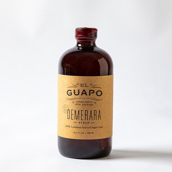 Large bottle of El Guapo Demerara syrup on a white background