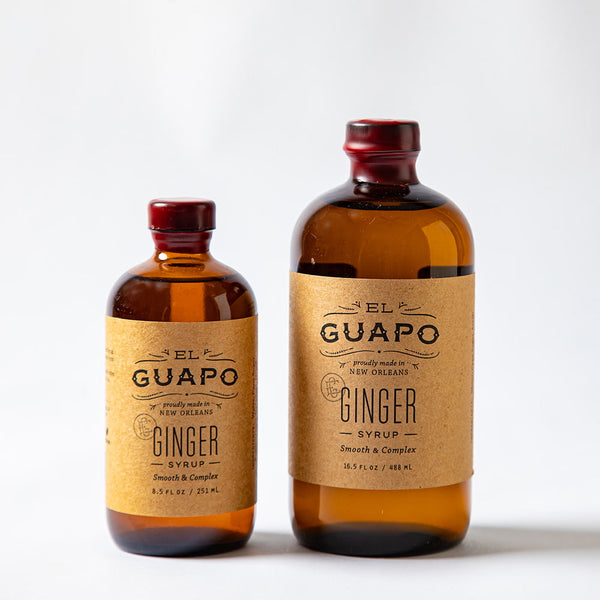 Size comparison of two bottles of El Guapo Ginger Syrup on a white background