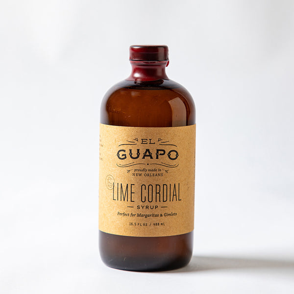 Bottle of large 16.5 oz El Guapo Lime Cordial Syrup on a white background