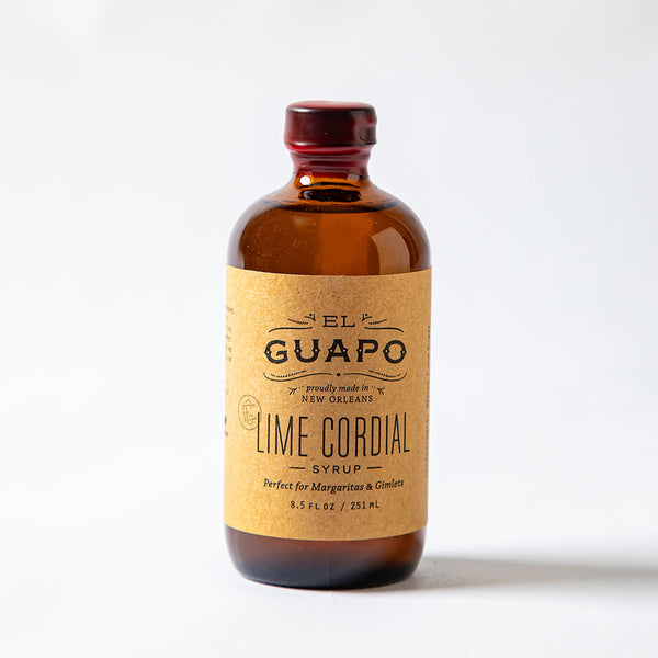 Bottle of small 8.5 oz El Guapo Lime Cordial syrup on a white background