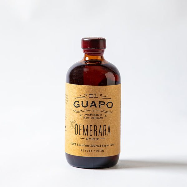Small bottle of El Guapo Demerara Syrup on a white background