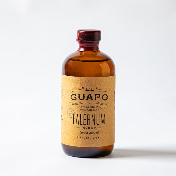 Small bottle of El Guapo Falernum Syrup on a white background