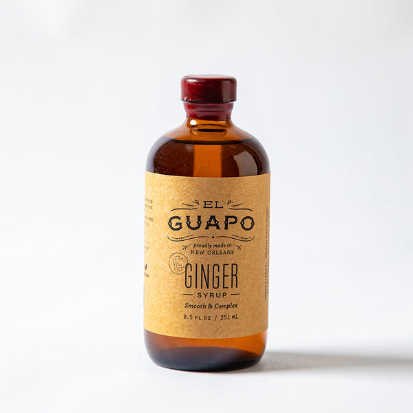 8.5 oz small bottle of El Guapo Ginger Syrup on a white background