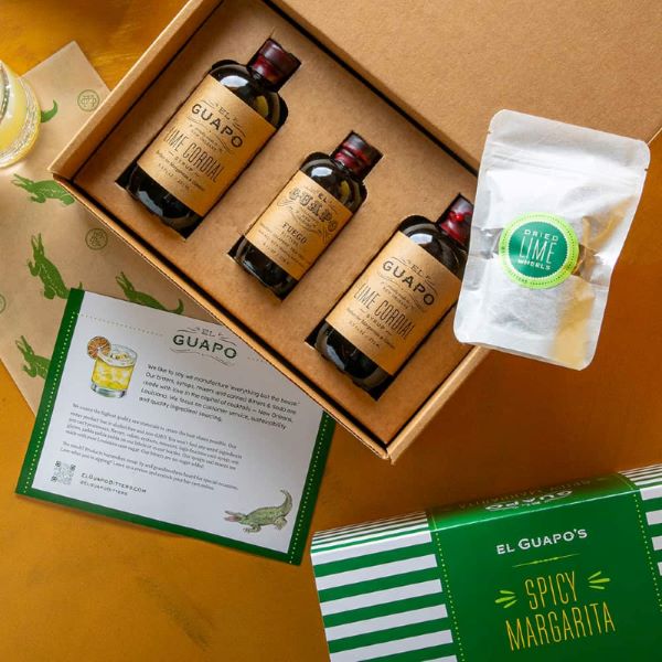 El Guapo Spicy Margarita Kit with mixer, bitters, and dried lime garnish.