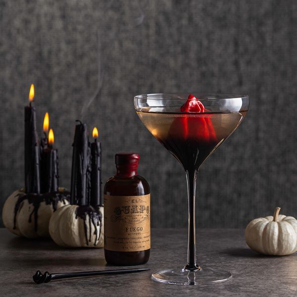 El Guapo Fuego spicy cocktail bitters bottle with Halloween martini.