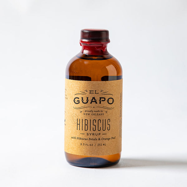 Small 8.5 oz bottle of El Guapo Hibiscus Syrup on a white background