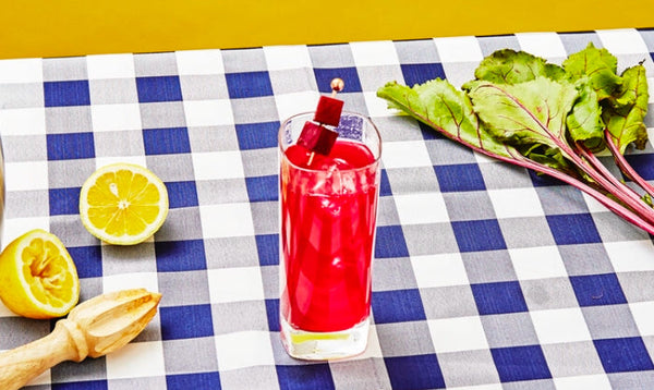 Vibrant pink Beet Gin and Tonic cocktail made with El Guapo Tonic Syrup