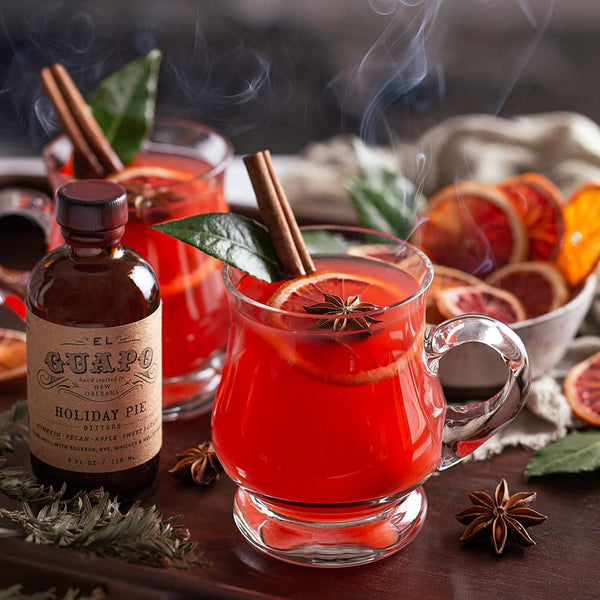 Blood Orange Hot Toddy cocktails next to El Guapo Holiday Pie Bitters
