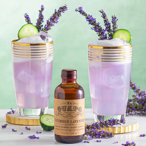 Cucumber Lavender Gin Fizz cocktails with cucumber slices and El Guapo Bitters