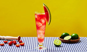 Savory Margarita cocktail made with El Guapo Lime Cordial alongside fresh limes