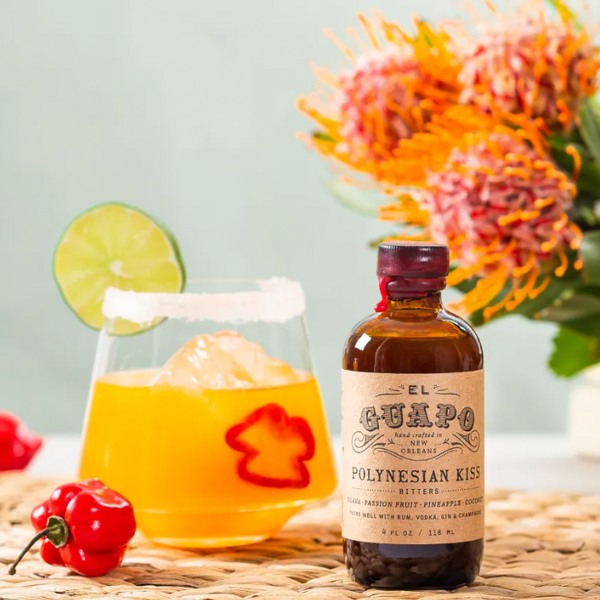 Passion Fruit Habanero Margarita next to a bottle of El Guapo Polynesian Kiss Bitters