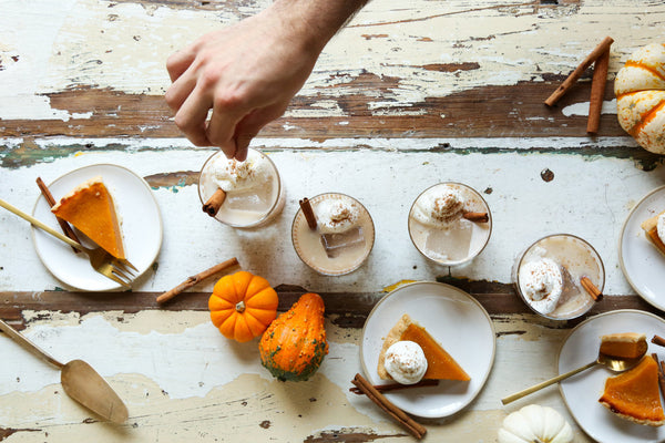 Seasonal Bourbon Milk Punch cocktails served alongside slices of sweet potato pie
