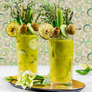 Verde Maria Tequila Cucumber Jalapeno cocktails with green garnishes and olives