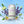 El Guapo Cucumber Lavender Bitters & Soda can with cucumbers, lavender, and water droplets on a blue background