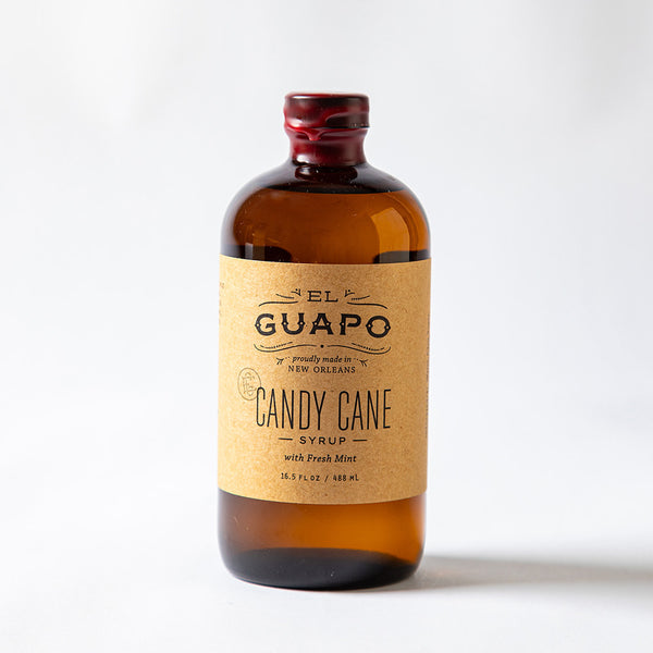Bottle of large El Guapo Candy Cane Syrup on a white background