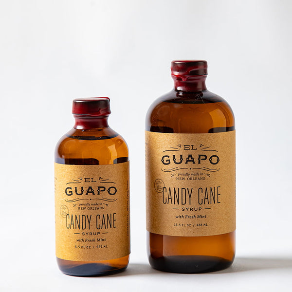 Size comparison of two bottles of El Guapo Candy Cane Syrup on a white background
