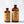 Size comparison of two bottles of El Guapo Ginger Syrup on a white background