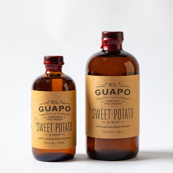 Size comparison of two bottles of El Guapo Sweet Potato Syrup on a white background