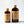 Size comparison of two bottles of El Guapo Tonic Syrup on a white background