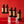 Five bottles of El Guapo Single Serving Mixers on a red background