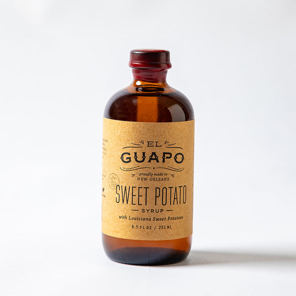 Small bottle of El Guapo Sweet Potato Syrup on a white background