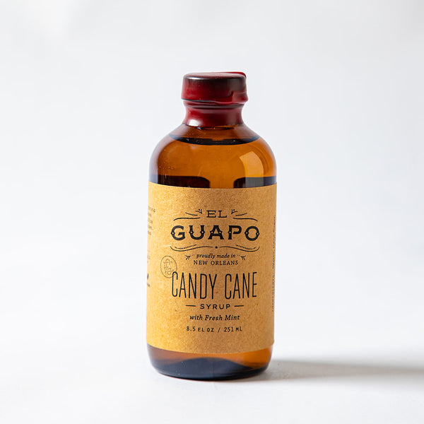 Bottle of small El Guapo Candy Cane Syrup on a white background