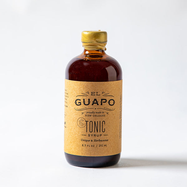 Bottle of small El Guapo Tonic Syrup on a white background