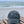 El Guapo embroidered logo baseball cap on a wooden bench at the beach.