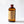 Side profile of large 16.5 oz El Guapo Hibiscus Syrup bottle with nutritional panel and ingredient list showing on a white background
